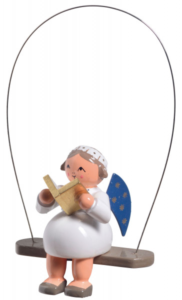 Engel auf Schaukel mit Buch